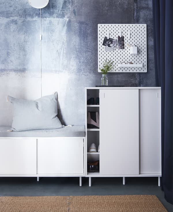 Maximise your small hallway using space-saving hallway furniture with double functions! IKEA offers a wide range for storing your stuff, such as MACKAPÄR bench in white with storage compartments for shoes that you also can sit on.