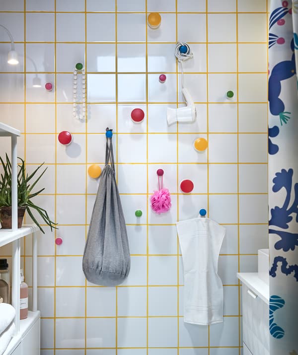 Maximize your bathroom storage! Attach easy-to remove hangers such as LOSJÖN with self-adhesive backings to a wall where you can hang different storage containers!