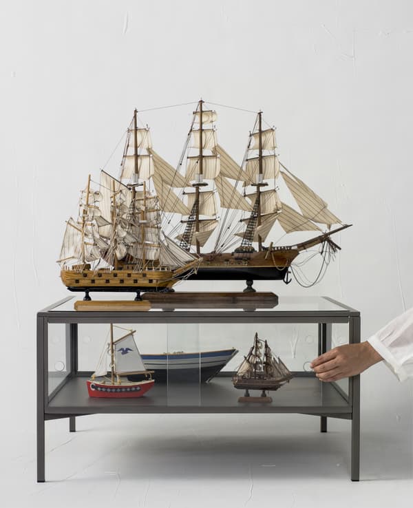 Model ships displayed on a coffee table.