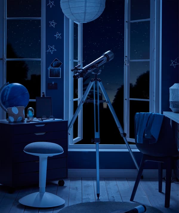 Moonlit room with telescope and high windows opening on starry skies.