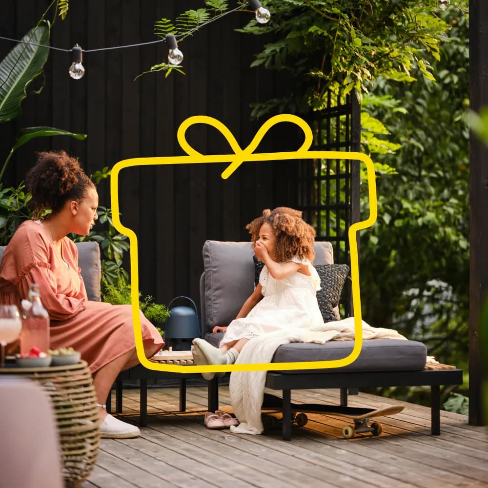 Mother and daughter sitting outside