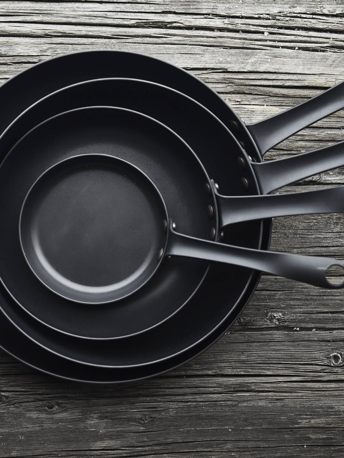 Multiple VARDAGEN pans stacked on top of each other