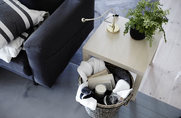 Near the guest bed, keep a basket filled with comforts like slippers, a cosy throw, books and a candle to encourage guests to relax from the stresses of travel. 