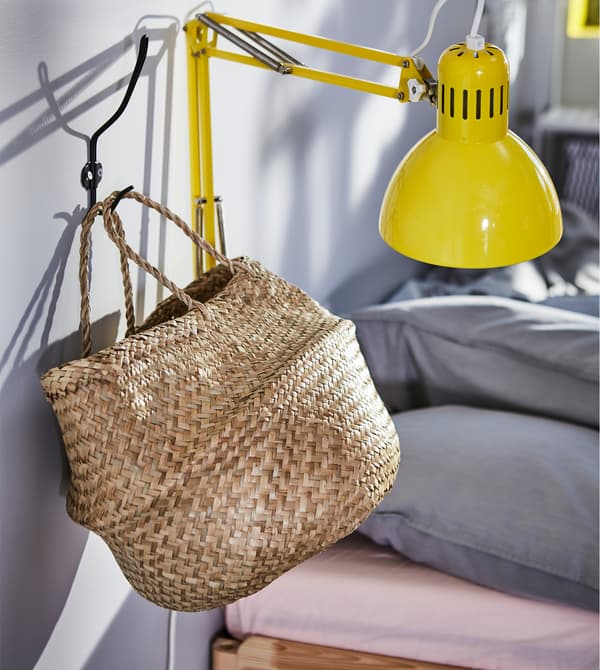 Need storage boxes for your small bedroom? Use a light beige seaweed basket to store your day and night time stuff.