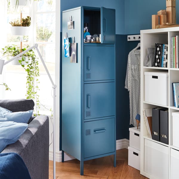 Next to a window is a narrow wall where IDÅSEN high cabinet with four doors fits perfectly since it's narrow too.