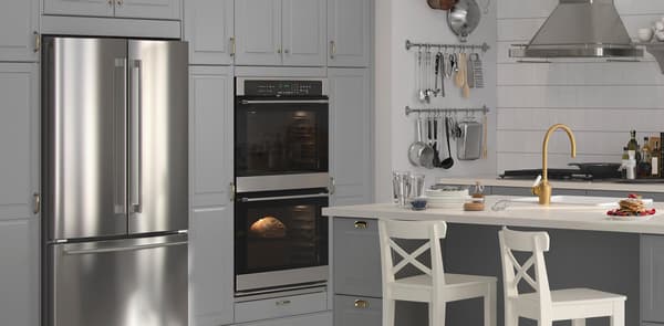 NUTID side by side refrigerator in BODBYN grey kitchen.