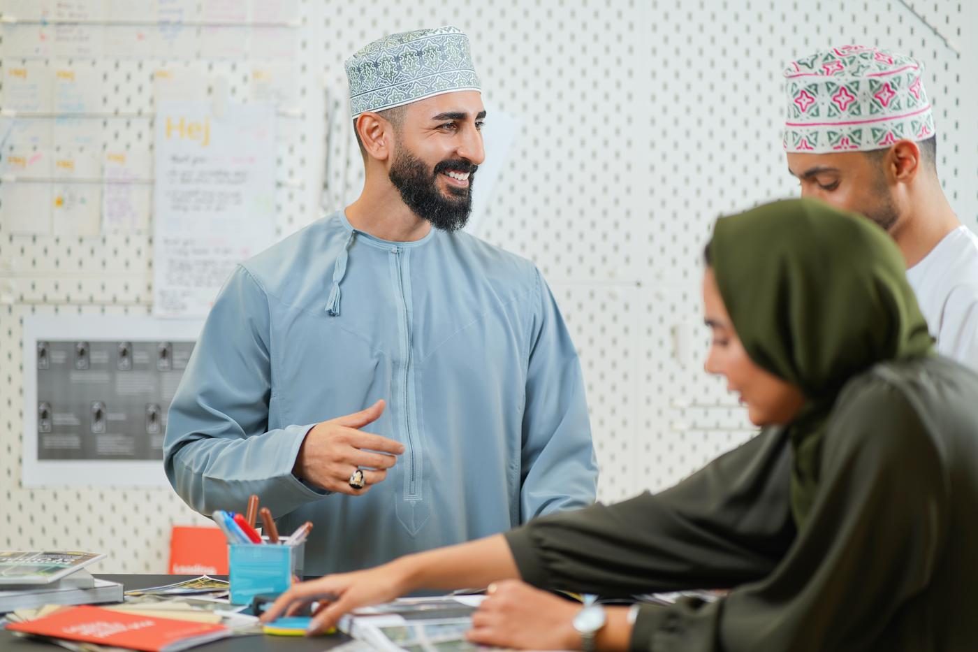 Omanis checking the IKEA catalogue.