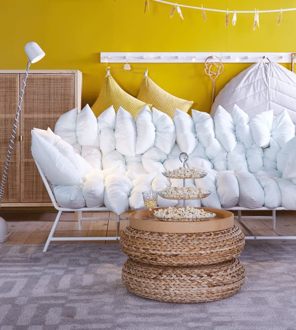 Our comfy sofa Loveseat from the IKEA PS 2017 collection has 36 pillows and comes in white or dark blue.