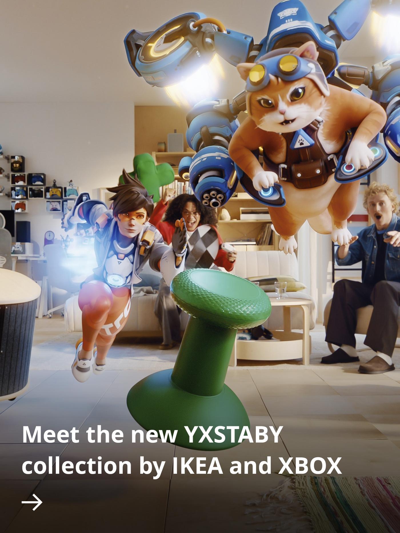 Overwatch characters Tracer and Jetpack Cat swoop through a bright living room, while two players react in the background and a green thumb-stick-shaped stool spins above the floor.