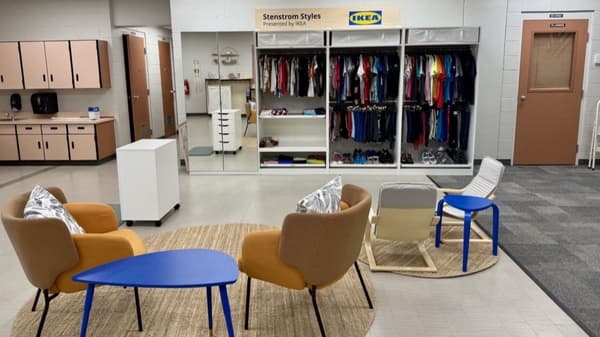 PAX units along wall with yellow chairs in front and blue tables, jute rugs on floor
