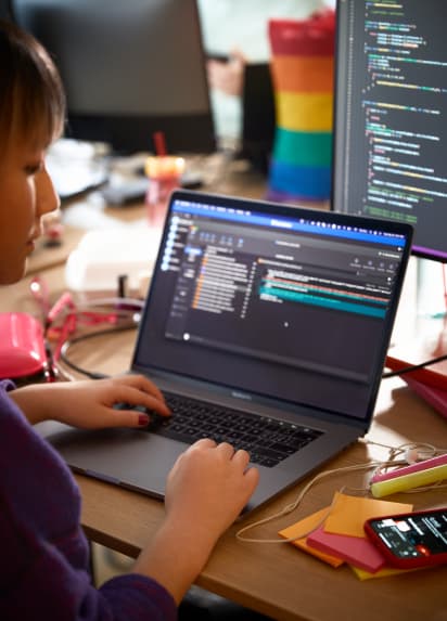 Person working on laptop writing code