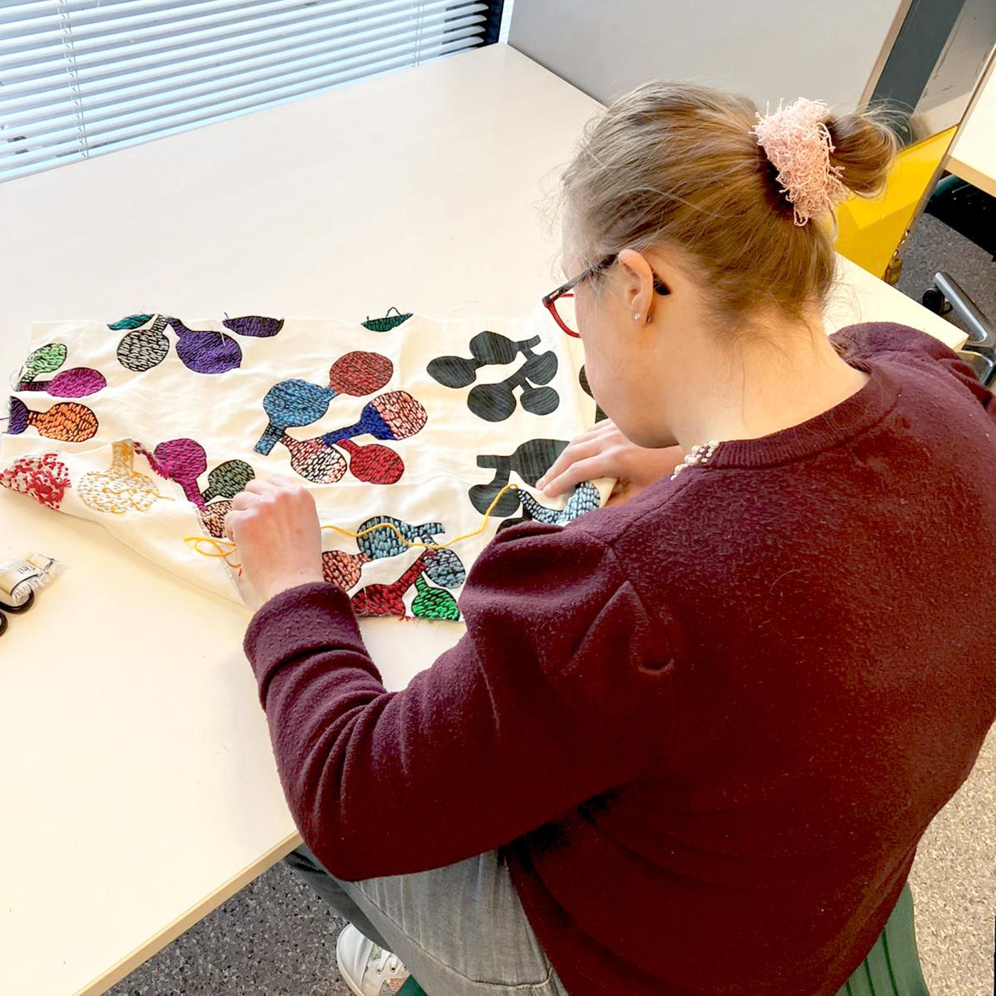 Person working on textiles