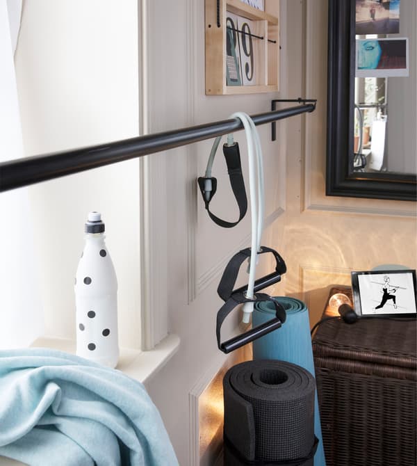 Personalise your workout space and boost motivation! Create a wall collage so that you are surrounded by the things you love. Try IKEA YPPERLIG wall shelf in solid birch.