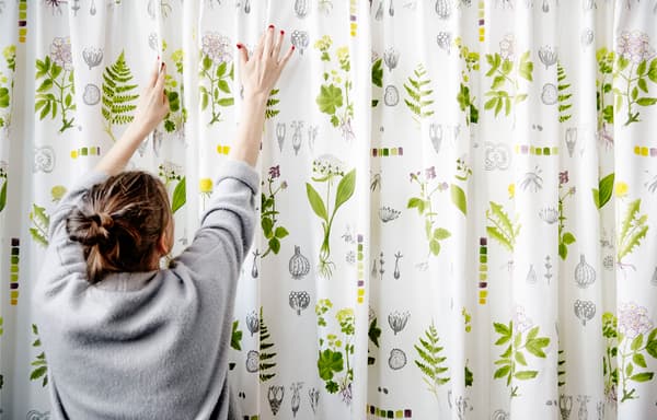 Picture of Agnes hanging fabric on a wall