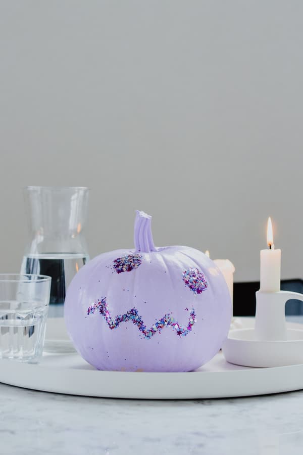 Purple pumpkin and a candle