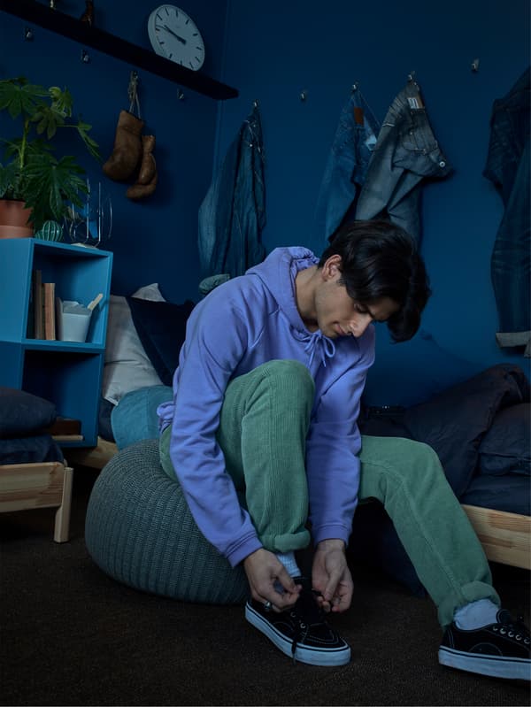 Ready. Tie your shoes on a soft knitted SANDARED grey pouffe. Go!