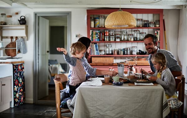 Rebecca’s family sharing a meal at the kitchen table.