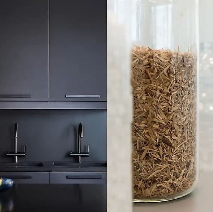 Recycled wood particles shown alongside kitchen cabinet fronts made of them.