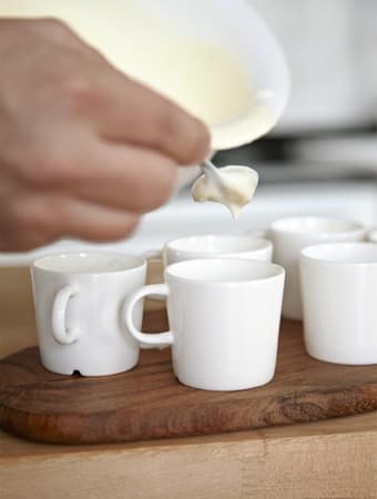 Rober decants the mixture for lemon mousse into espresso cups