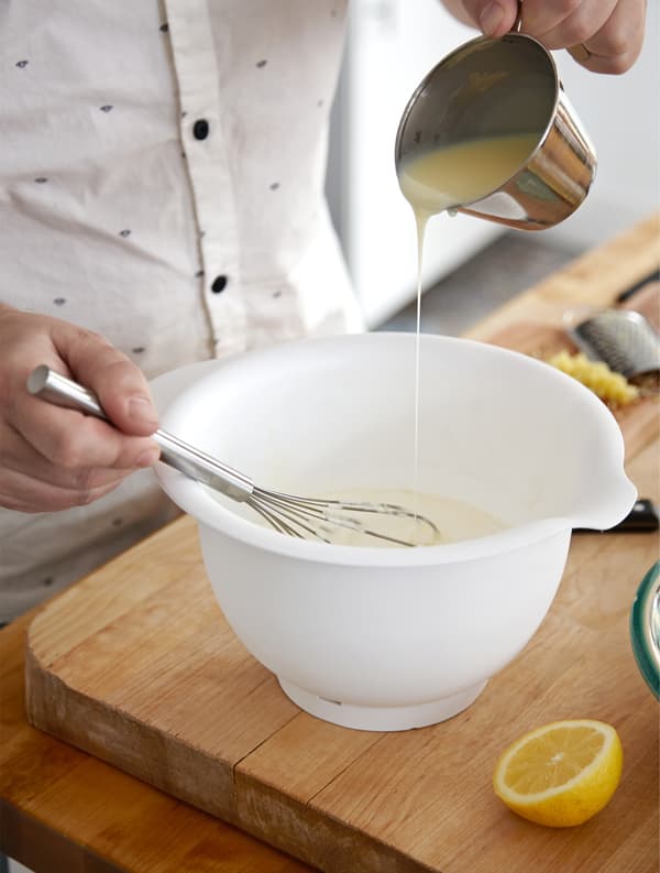 Rober whisking up the ingredients for a lemon mousse.
