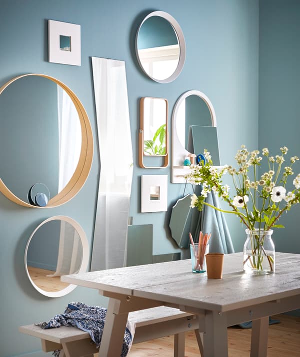 Set up a stylish collage wall of mirrors! Try a mix of different styles such as IKEA SALTRÖD mirror with shelf and hooks.