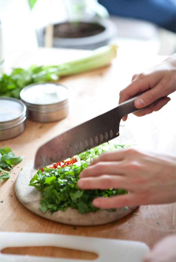 Shalony chops the ingredients.