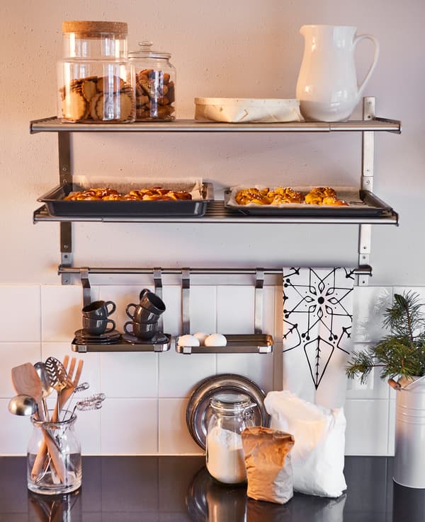 Shelving and storage above a kitchen counter that is ready for baking.