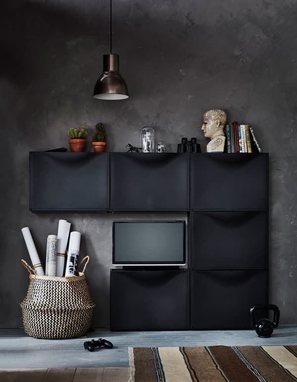 Six IKEA TRONES shoe cabinets are arranged to create an entertainment center, with a TV sitting on one.
