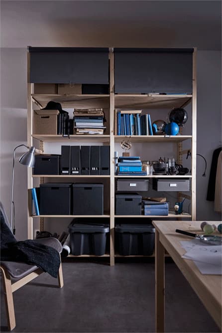 Small space organisation is a dorm room prio. Even if your storage is a big mess, you can cover it up! Get some TUPPLUR block-out roller blinds from IKEA, like these gray ones, and attach them to a shelving unit. Roll them down to hide your stuff. 