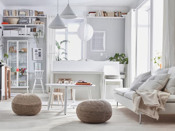 SÖDERHAMN sofa in a bright room with rattan chairs around.