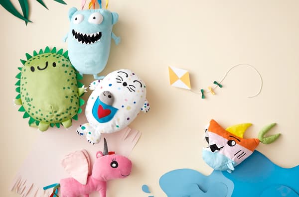Soft toys with funny faces and features drawn by kids and produced by IKEA and sold in IKEA stores globally.