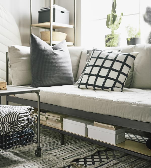 Space saving furniture is a perfect solution as small apartment furniture. IKEA has a smart sofa called EKEBOL in beige and steel that has smart shelves  for storage underneath and behind it.