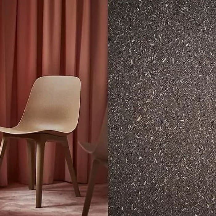 Speckled composite surface next to a contemporary chair.