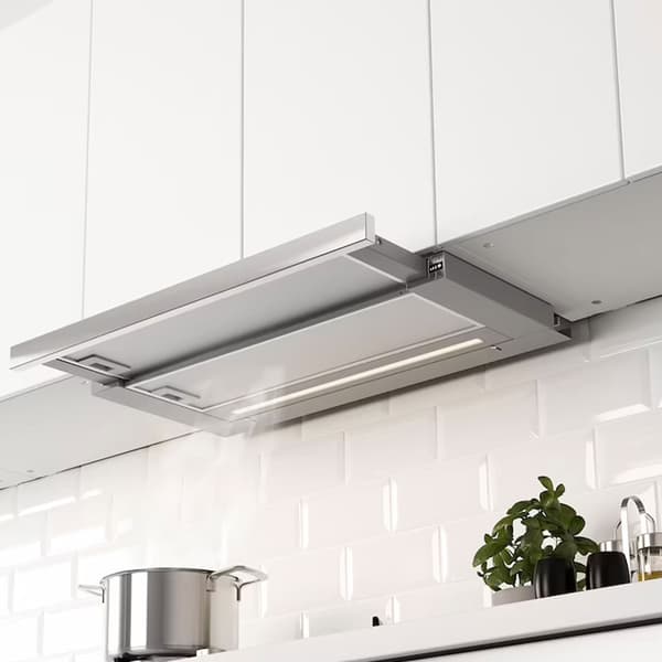Stainless steel fan installed into cabinets above oven