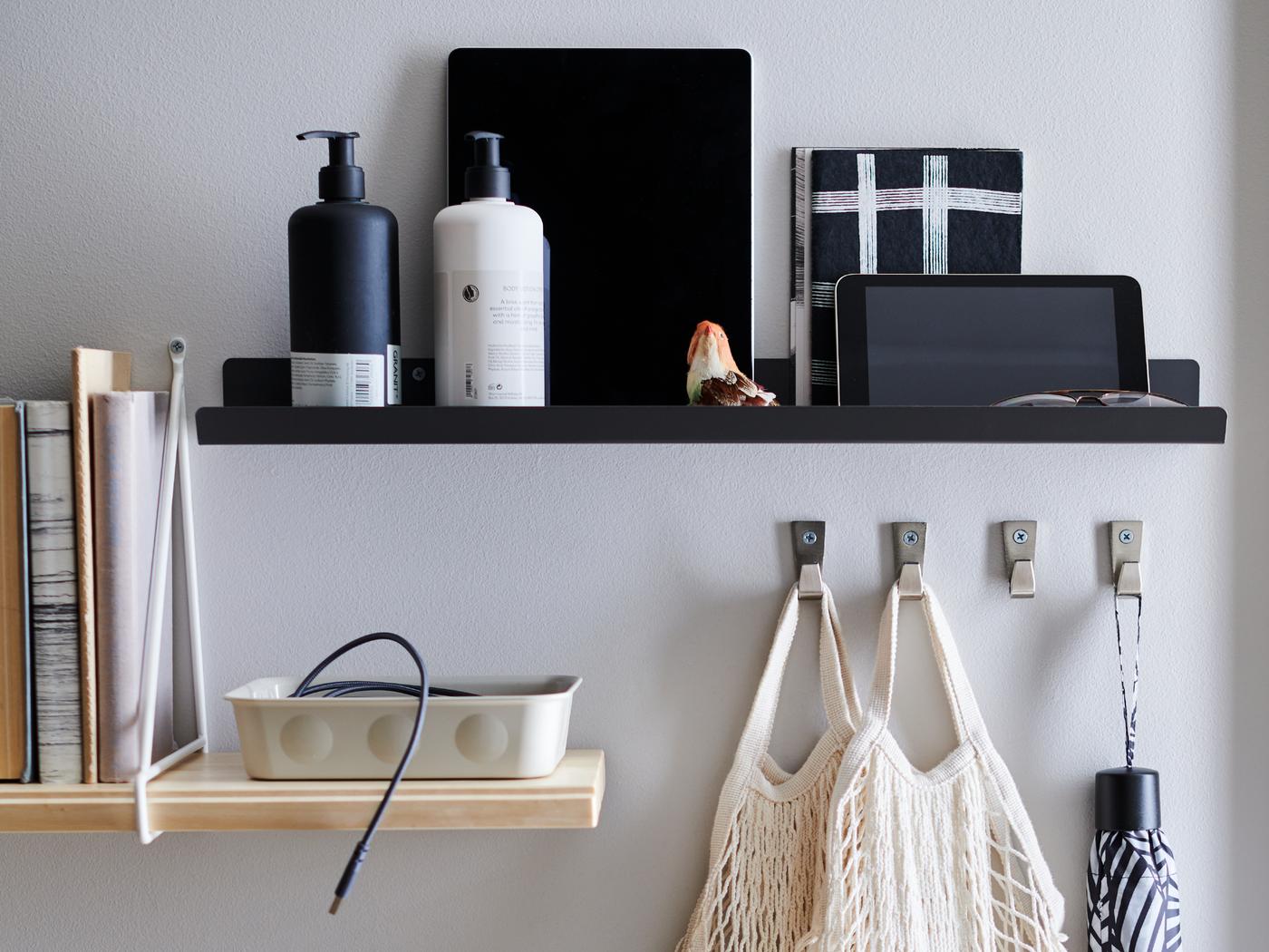 Standing on an old, worn chest of drawers are a set of RAGGISAR textile baskets, filled with trinkets and clutter.