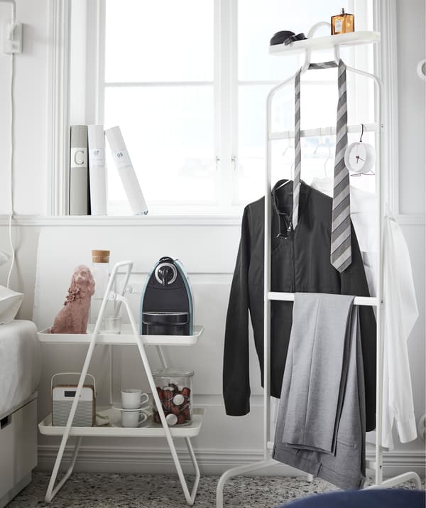 Start your morning off right thanks to an IKEA VIGGJA tray stand coffee station next to your bed.