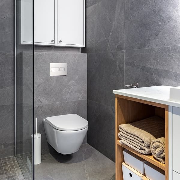 Stylish bathroom with wall-hung toilet and grey tile design