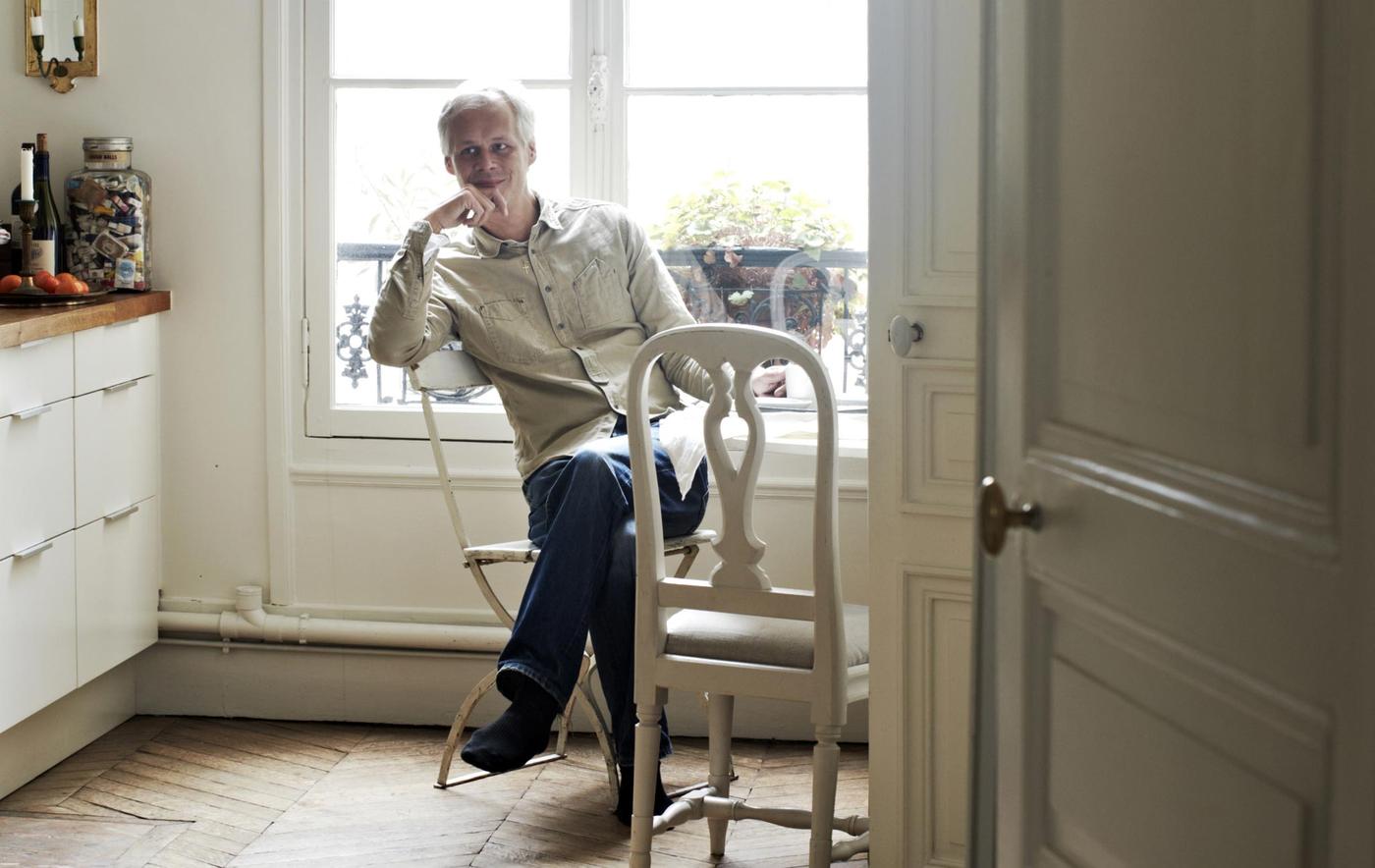 Stylist Hans Blomquist relaxes at his kitchen table.