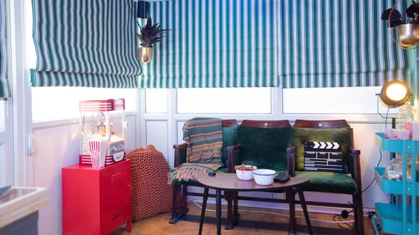 The conservatory come laundry room has become a multi-functional space with a home cinema solution