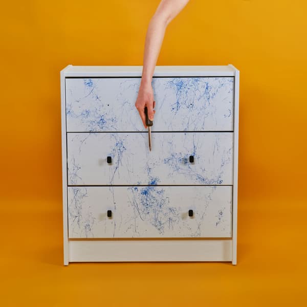 The drawer is assembled together, handles are on their places.