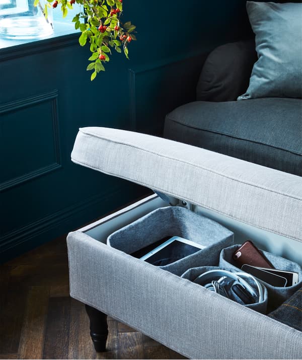 The grey-beige IKEA STOCKSUND bench with a hardwearing textile cover offers extra seating and hidden storage.