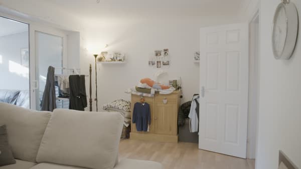 The living room was mostly used for laundry and ironing. The large sofa took almost half of the floor space