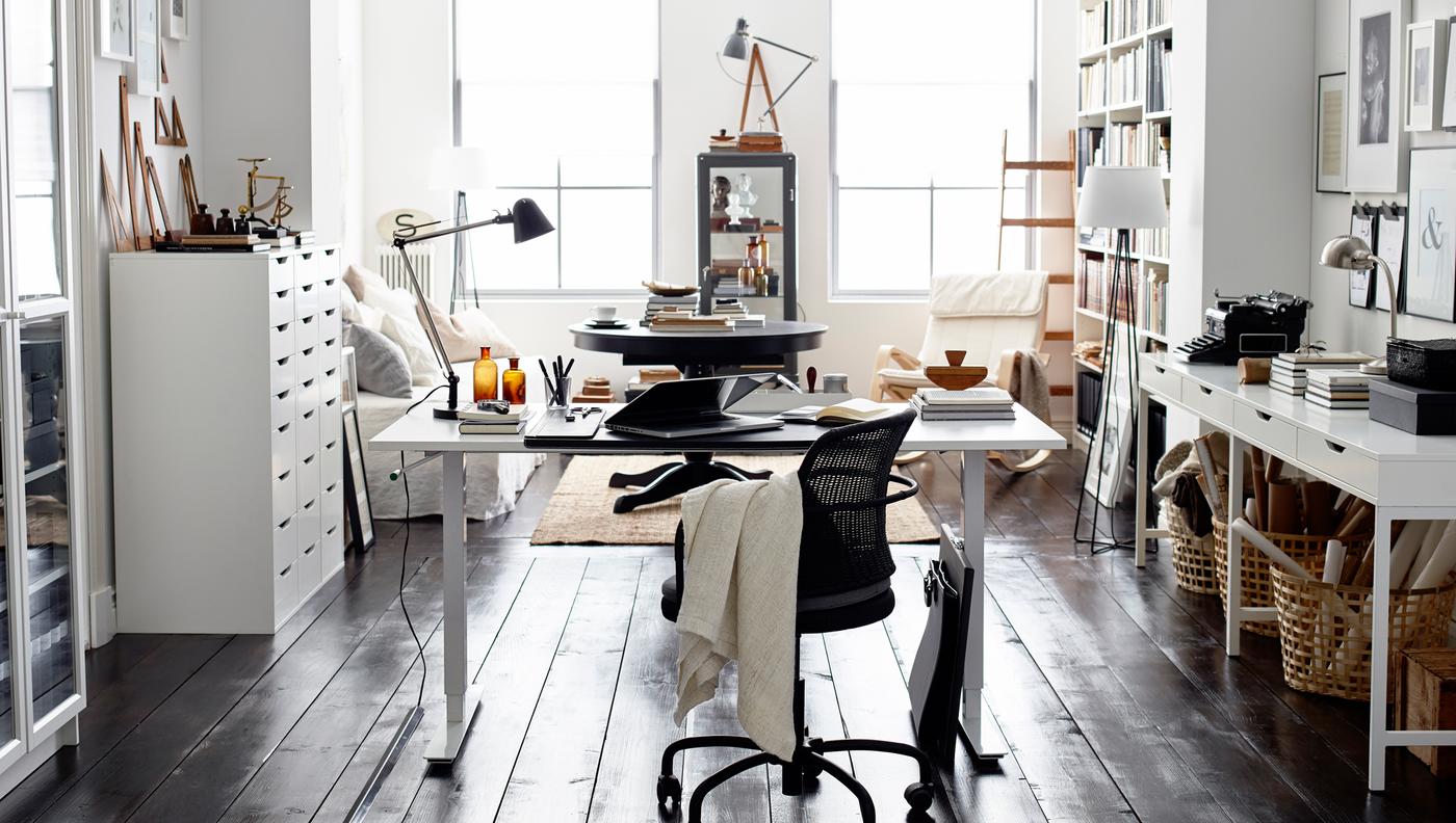 The neutral colors and mix of black and white in this home office make for a style that last longer than the latest trend.