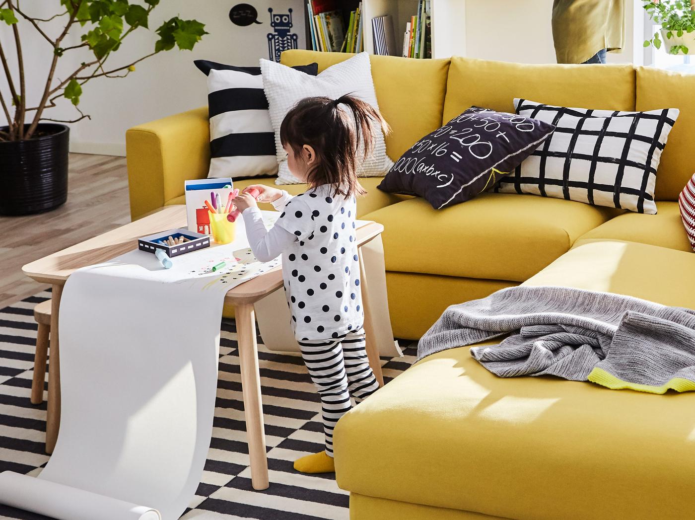 The yellow IKEA VIMLE three seat sofa brings lots of comfort and a little sunshine into your living room.