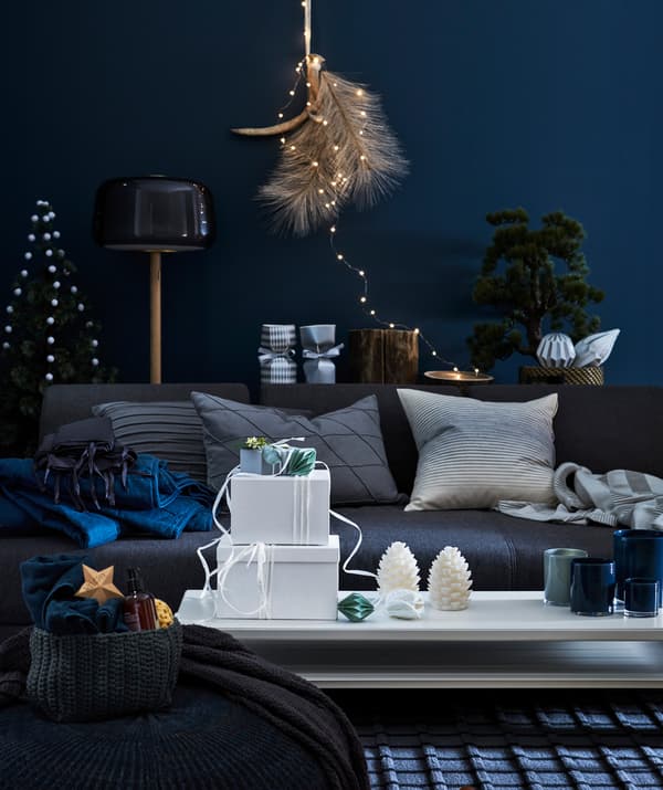 These white IKEA TJENA storage boxes with lids can also double as fancy, white gift boxes.