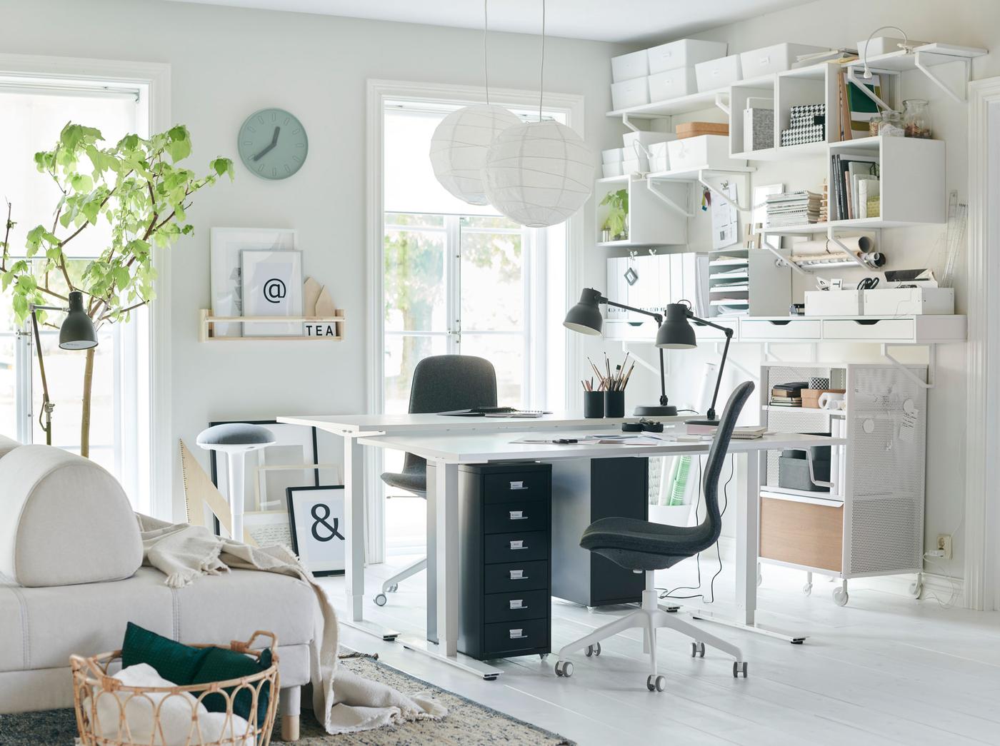This all-white home office stays organised with a wall for storage using IKEA EKBY storage cabinets and wall shelves. Let in some light and get to work!