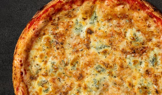 Three cheese pizza with a blend of Tilzītes, Holandes, and blue cheese, sprinkled with oregano.