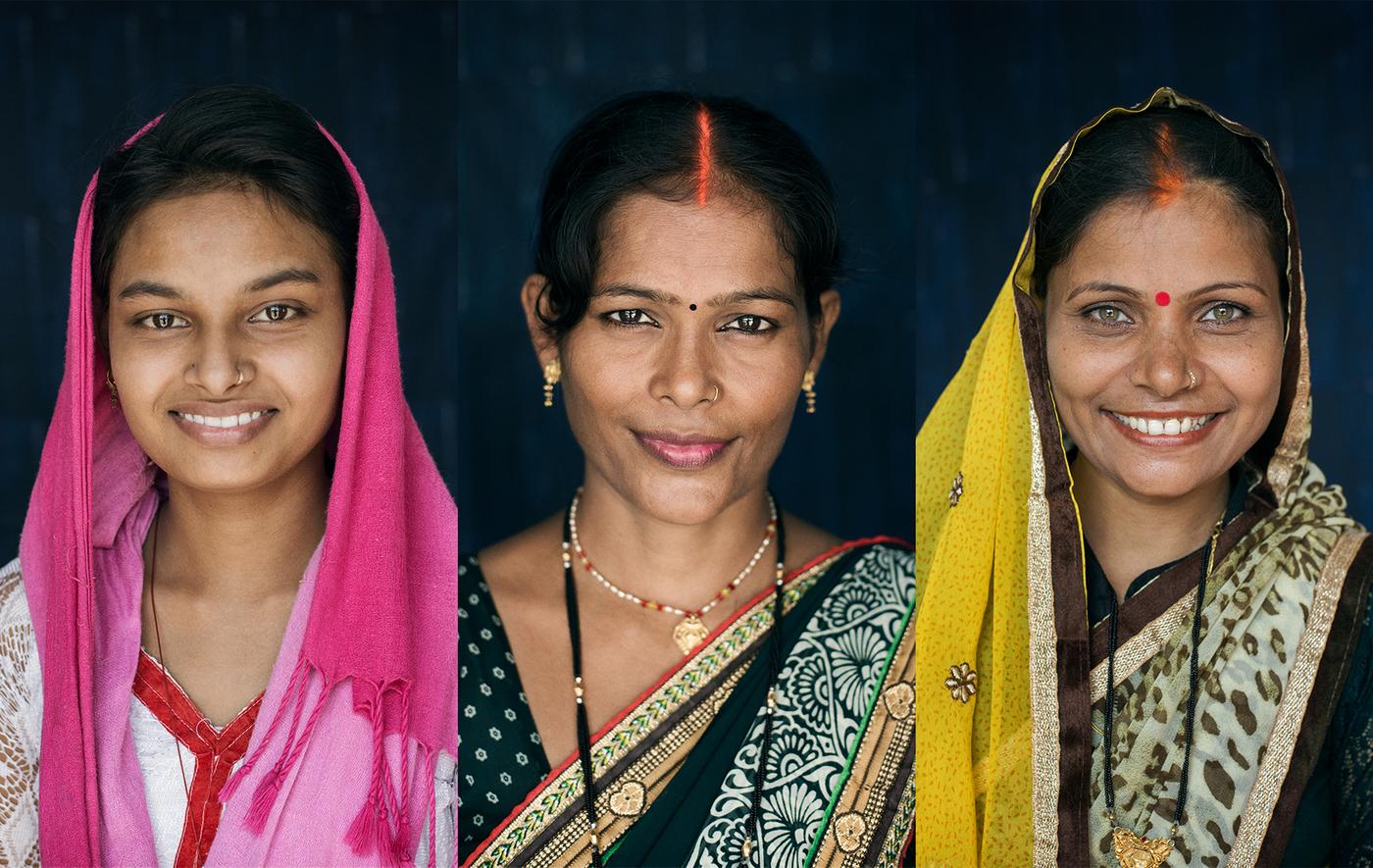 Three women smiling.