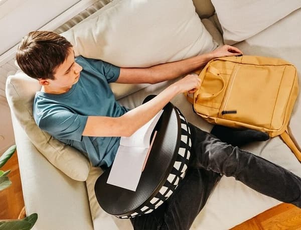 Trading in your table for a laptop support means you can learn outside, on the sofa, or even just in bed