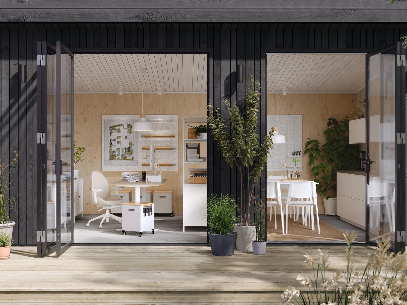 TROTTEN desks and other office furniture in a modern one-storey building with open French doors and a wooden deck outside.